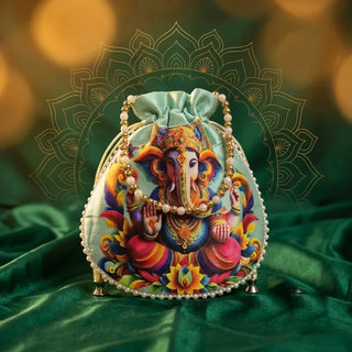 Mint green Ganesha potli bag (drawstring pouch) with pearl trim on green velvet