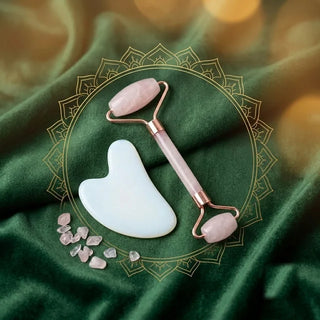 Rose quartz face roller and white opal gua sha stone with rose quartz chips on green velvet