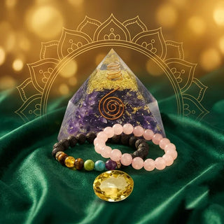 Amethyst orgone Vastu pyramid, 7 chakra bracelet, rose quartz bracelet and an oval citrine stone on green velvet