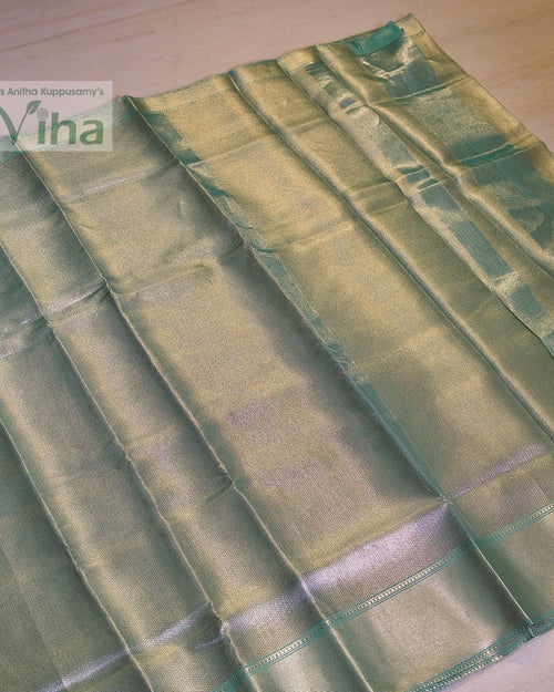 Premium Katan Silk Saree With Blouse, a folded light-green-and-yellow-toned fabric with a glossy finish and striped border detailing