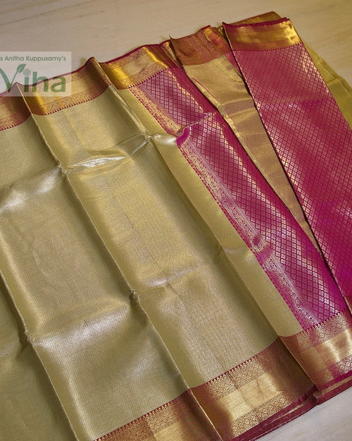 Premium Katan Silk Saree With Blouse, a gold-toned and magenta fabric with folded pleats and woven geometric patterns