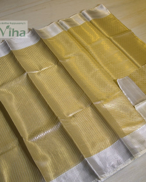 Premium Katan Silk Saree With Blouse, a shiny gold-toned fabric with wide silver-toned borders