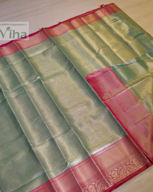 Premium Katan Silk Saree with Blouse, folded green textile with pink and gold-toned borders and woven patterns