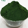 Kubera Green Kumkum / Green Kumkum, a transparent glass bowl filled with a mounded heap of fine dark green powder