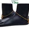 Impon Payal, two glossy black mannequin feet display a pair of shiny gold-toned chain anklets adorned with small round beads and dangling bell charms