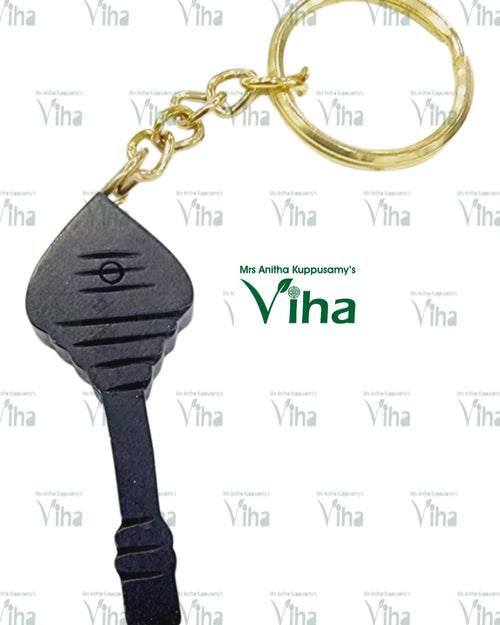 Karungali Wood "VEL" Key Chain, a gold-toned metal split ring with a four-link chain attached to a black carved pendant featuring horizontal grooves