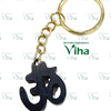 Karungali Wood "OM" Key Chain, a gold-toned metal split ring attached via a short chain to a black, irregularly shaped pendant