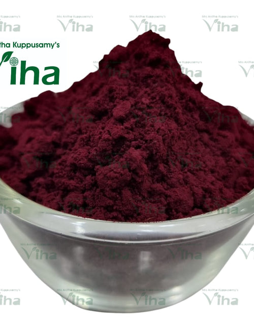 Meenakshi Thazhampoo Kumkumam, a rounded, glossy clear bowl filled with fine, textured dark red powder