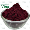 Lemon Flavour Maroon Kumkum, a translucent glass bowl holding a mound of matte maroon powder with a grainy, textured surface