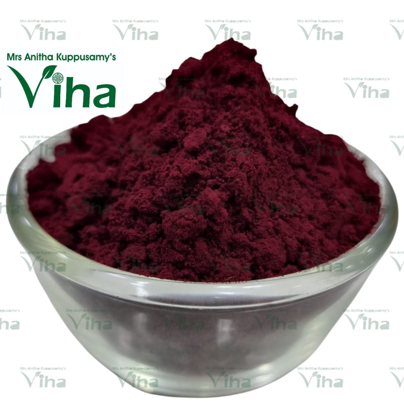 Lemon Flavour Maroon Kumkum, a translucent glass bowl holding a mound of matte maroon powder with a grainy, textured surface