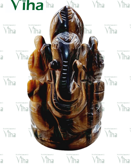 Tiger Eye Ganesh Statue, seated deity with elephant head and ornate carvings