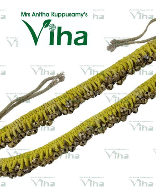 Dancing Ghungroo, a yellow-toned braided cord with metallic bells attached along its length, featuring grey tie strings at both ends