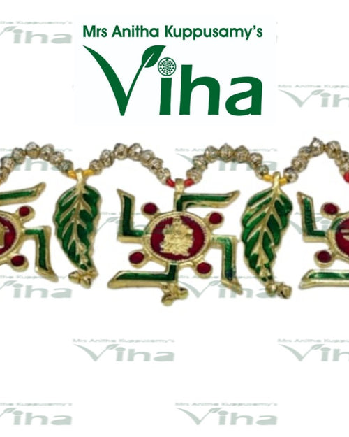 Swastik Thoran, a gold-toned decorative hanging featuring alternating green-enamelled leaves, swastikas, and roundels interspersed with beaded swags