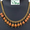 Impon Floral Necklace, a gold-toned mesh necklace featuring fifteen orange flower-shaped pendants accented by tiny green and gold-toned beads