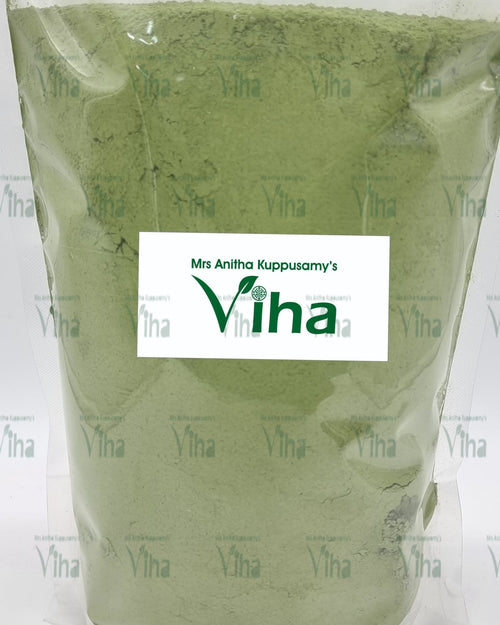 Indigo Powder, a transparent plastic pouch filled with dull green powder, featuring a central white label with dark green lettering and a leaf icon