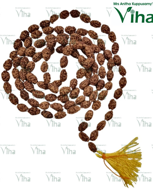 Face Rudraksh Mala, a long strand of brown textured oval beads with a yellow tassel at one end