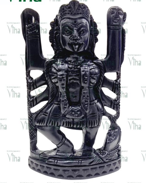 Karungali Kali Amman, multi-armed figure carved in black karungali wood with arms raised on both sides