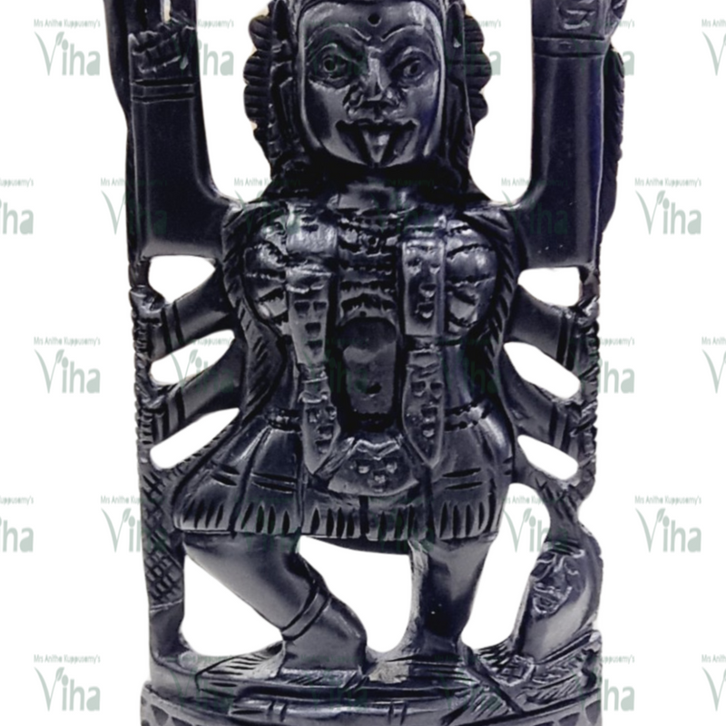 Karungali Kali Amman, multi-armed figure carved in black karungali wood with arms raised on both sides