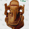 Wooden Ganesha, plain carved face with large ears and a long trunk curving down, unpainted