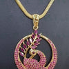 Impon Pendant Chain, a gold-toned necklace with a circular pendant featuring a peacock design encrusted with pink stones and a dangling teardrop stone