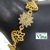 Impon Bracelet, a gold-toned bracelet with three linked floral motifs, including a central flower set with twelve clear stones surrounding one large stone