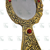 Hand Mirror, a gold-toned hand mirror featuring an oval glass pane and ornate embossed handle with four red circular stones