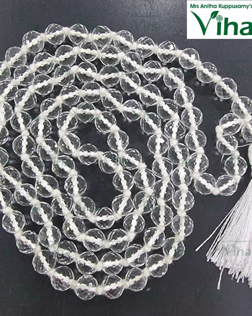 Sphatik Mala Original, coiled mala of clear faceted beads ending in a white tassel