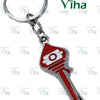Vel Keychain Metal, pendant attached to a split ring by a chain