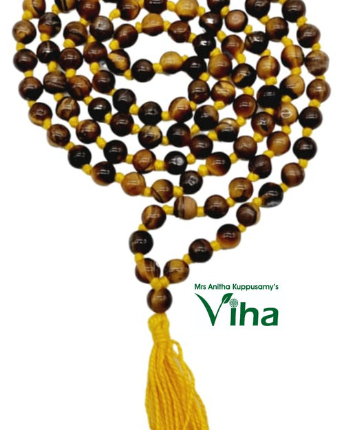 Tiger Eye Stone Mala, yellow string and a tassel hanging below