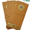 Gift Cover, five brown pouches fanned out and tied with gold-toned string