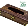 Wooden Tissue Holder, brown rectangular box with floral carvings, a central scalloped cutout, gold-toned metal inlays, corner plates, and a front latch