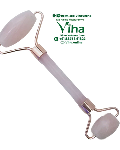 Rose Quartz Face Roller, a pink-tinted dual-ended facial roller featuring two round stones and copper-toned metal hardware