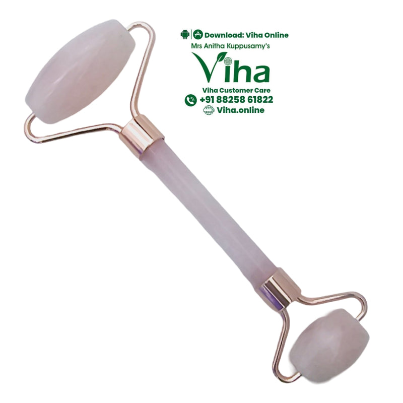 Rose Quartz Face Roller, a pink-tinted dual-ended facial roller featuring two round stones and copper-toned metal hardware