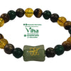 Zibu Money Coin Bracelet, a beaded bracelet featuring round multi-colored stones and a central carved green bead with gold-toned markings