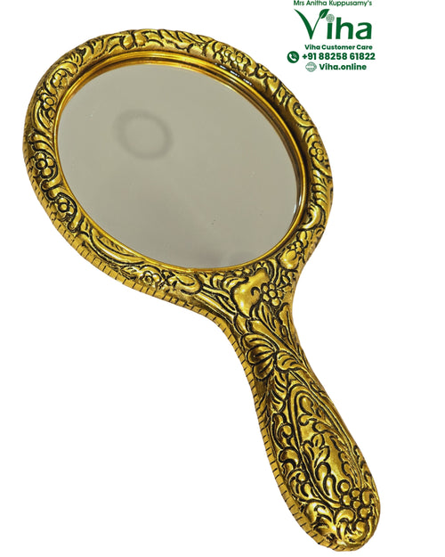 Designer Hand Mirror Big, a gold-toned hand mirror featuring an ornate, embossed frame with floral and abstract motifs on both handle and border