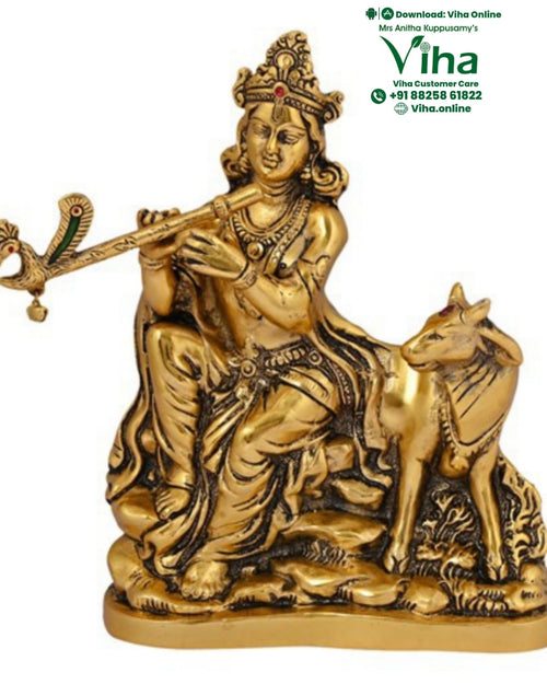 Krishna playing the flute, seated figure with a cow standing alongside on a shaped base