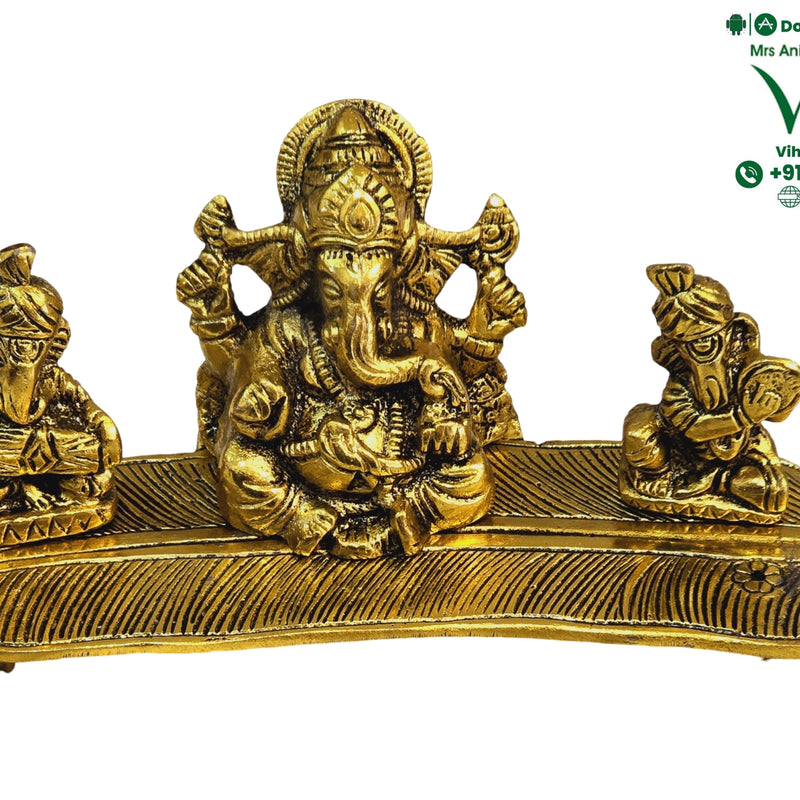 Ganesha group on a leaf-shaped base, a larger elephant-headed figure seated between two smaller seated figures