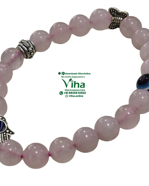 Evil Eye Rose Quartz Bracelet, pink beads around a blue and white eye bead