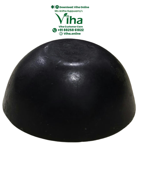 Spirulina Soap, a black dome-shaped object with a smooth, matte finish