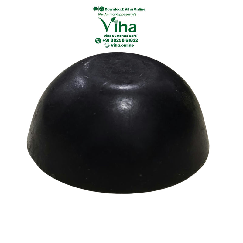 Spirulina Soap, a black dome-shaped object with a smooth, matte finish