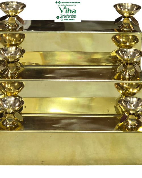 3 Step Pooja Stand, brass tiered step stand with small lamp bowls on petal bases at both ends of each step
