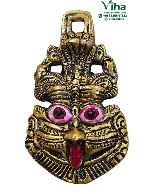 Drushti Wall Hanger with a stylized face and cobra hood