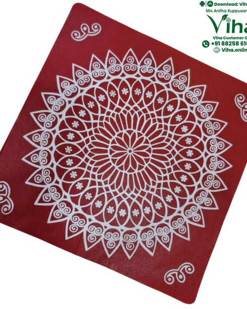Rangoli Sticker - Kolam, a red square mat with a white circular mandala design, corner scroll motifs, and a glossy finish