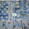 Cotton Silk Saree with Blouse, a blue fabric featuring white patterns, vertical stripe motifs, and metallic-toned woven borders at the edges