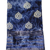 Cotton Silk Saree with Blouse, a folded blue tie-dye fabric featuring off-white damask motifs and five metallic-toned horizontal border stripes
