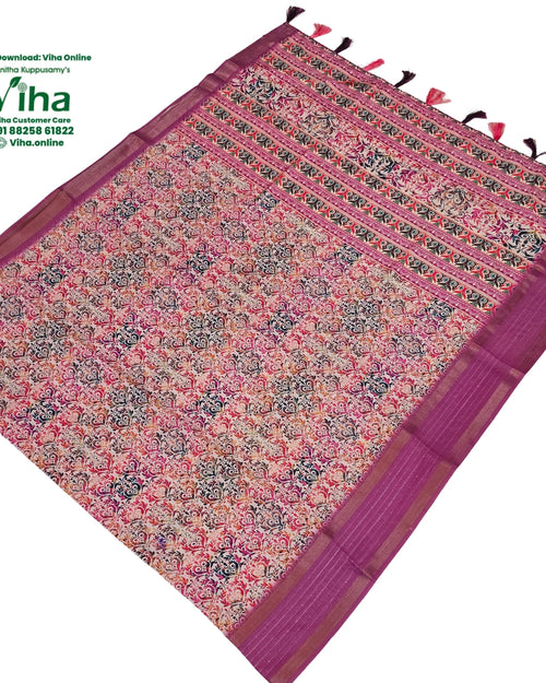 Fancy Cotton Silk Saree With Blouse, a patterned pink fabric with floral motifs, purple borders, and twelve hanging tassels on one edge