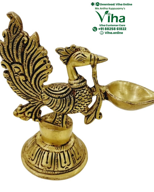 Brass annam (swan) stand lamp, bird with a fanned tail holding an oil spout on a pierced round base