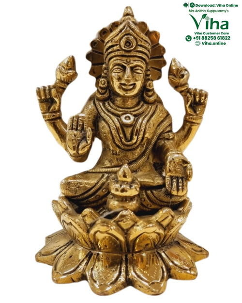 Mahalakshmi Statue with Kalash - Brass, a gold-toned metallic seated figure with four arms, holding lotus buds, on an elaborate lotus base