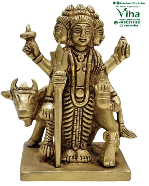 Dhattatreya in brass, three-headed multi-armed figure standing with a cow behind and dogs at the feet