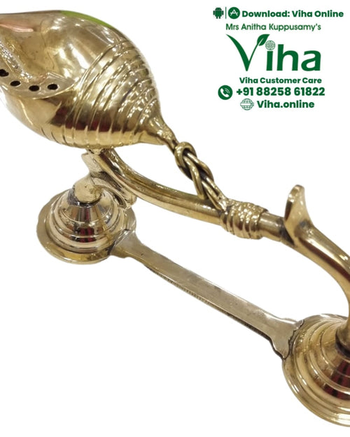 Sangu aarti deepam in brass, conch-shaped pierced oil vessel on a long ornate handle